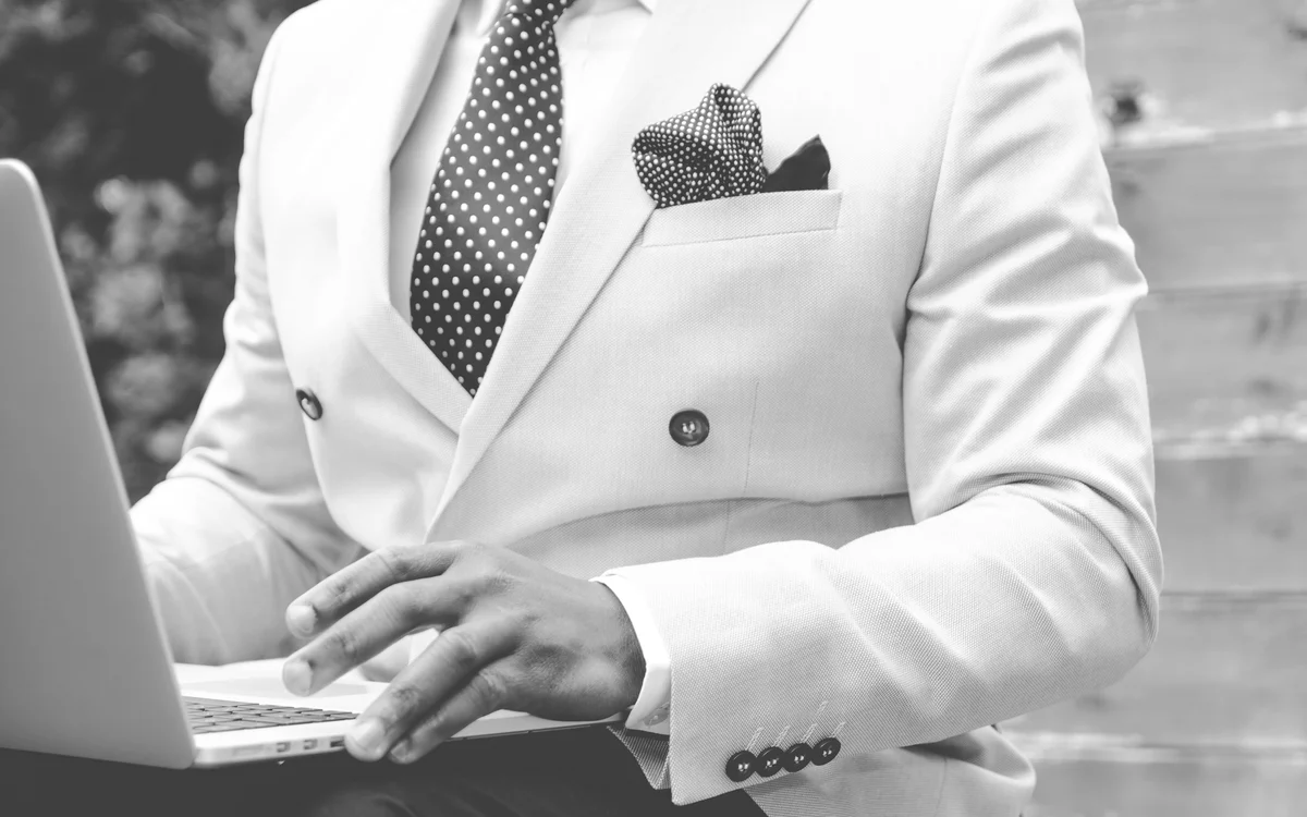 File photograph of a person reviewing a laptop, illustrating account checks after a breach notice.
