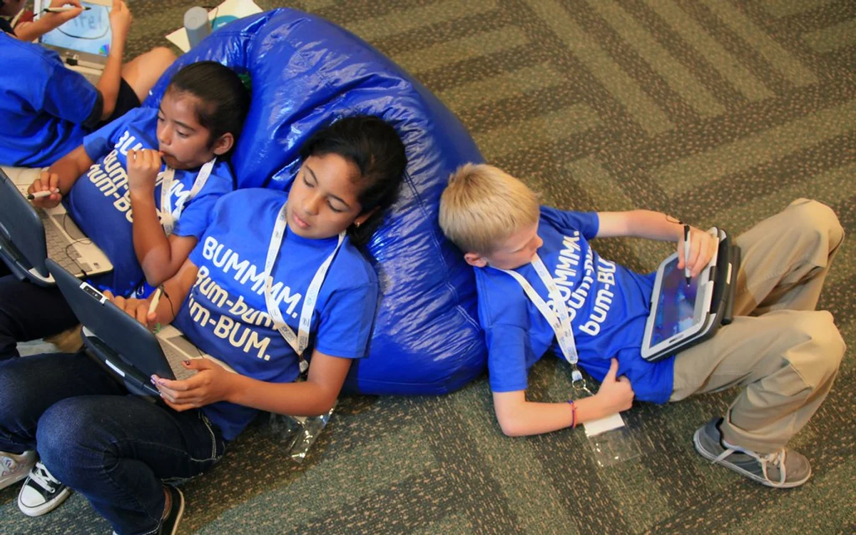 Children using educational tablets together, illustrating the need for family digital safety.