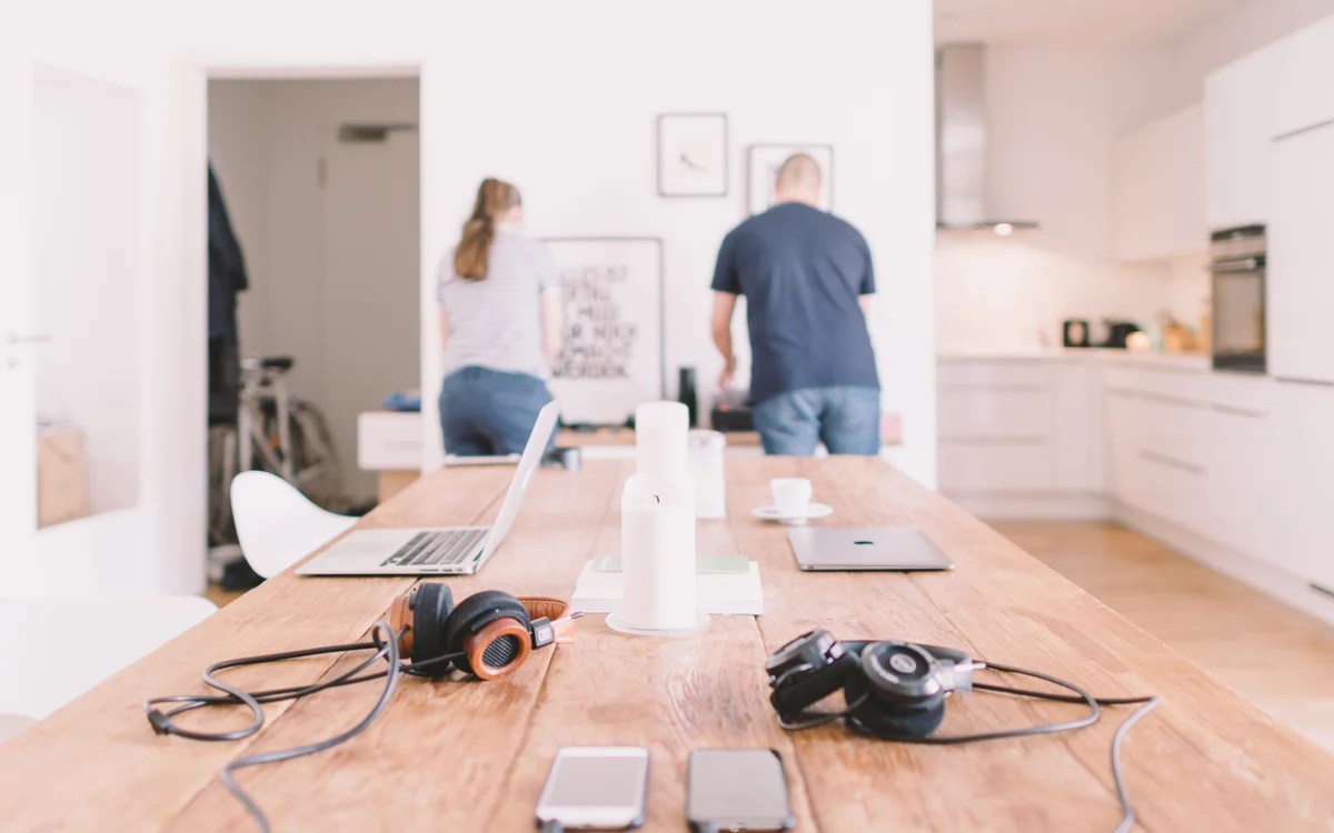 Illustrative photograph of a shared home workspace, for comparing privacy services with do-it-yourself work.